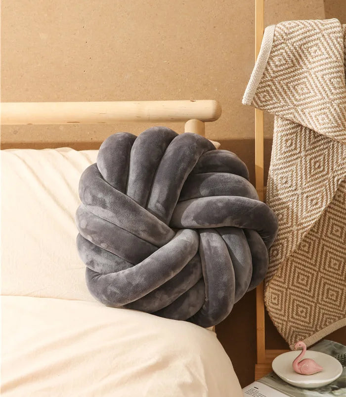 Coussin nœud rond décoratif