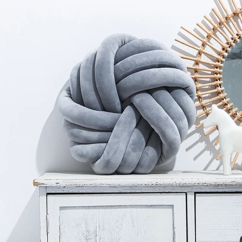 Coussin nœud rond décoratif