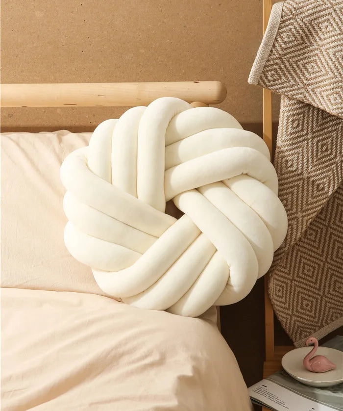 Coussin nœud rond décoratif