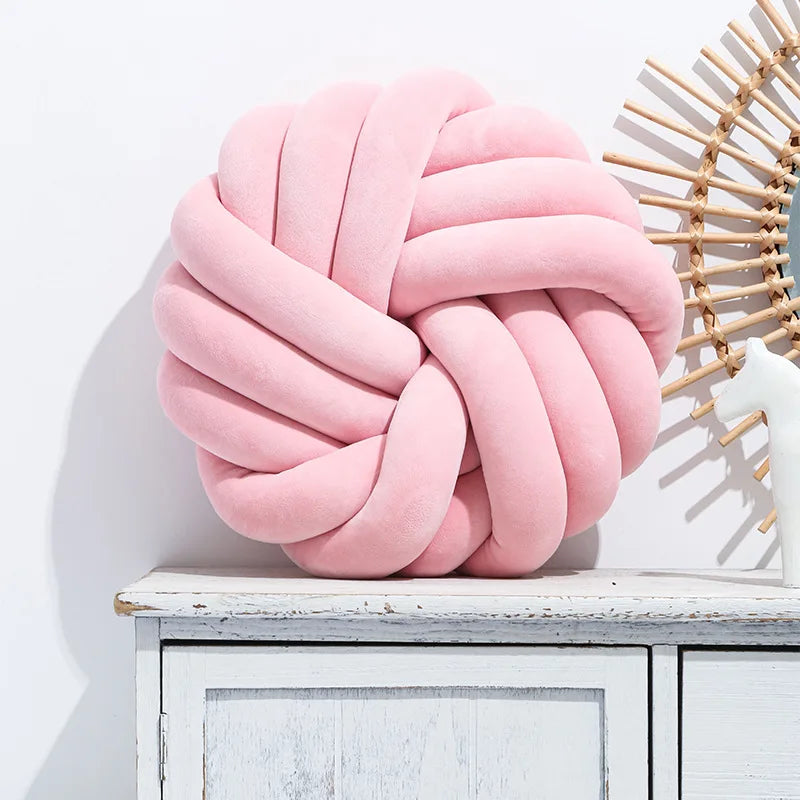 Coussin nœud rond décoratif