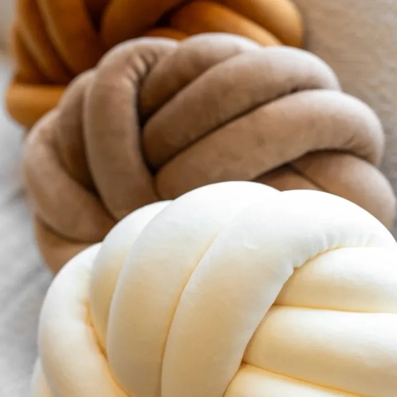 Coussin nœud rond décoratif