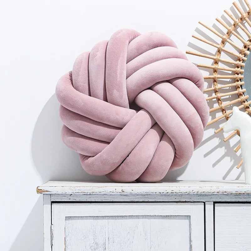Coussin nœud rond décoratif