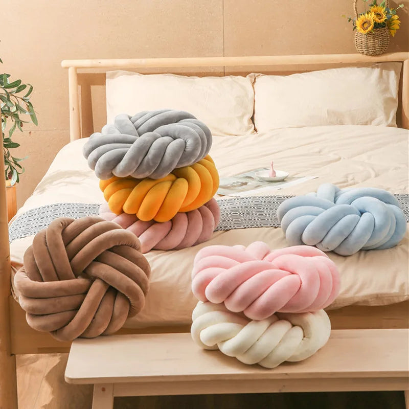 Coussin nœud rond décoratif