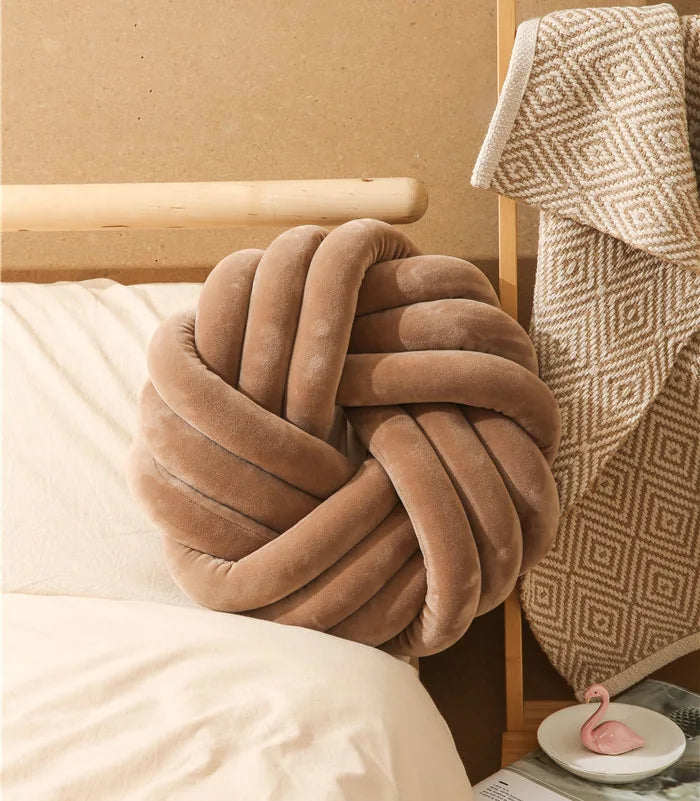 Coussin nœud rond décoratif