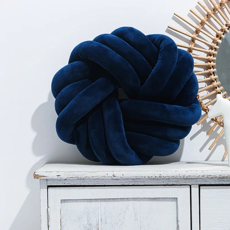Coussin nœud rond décoratif